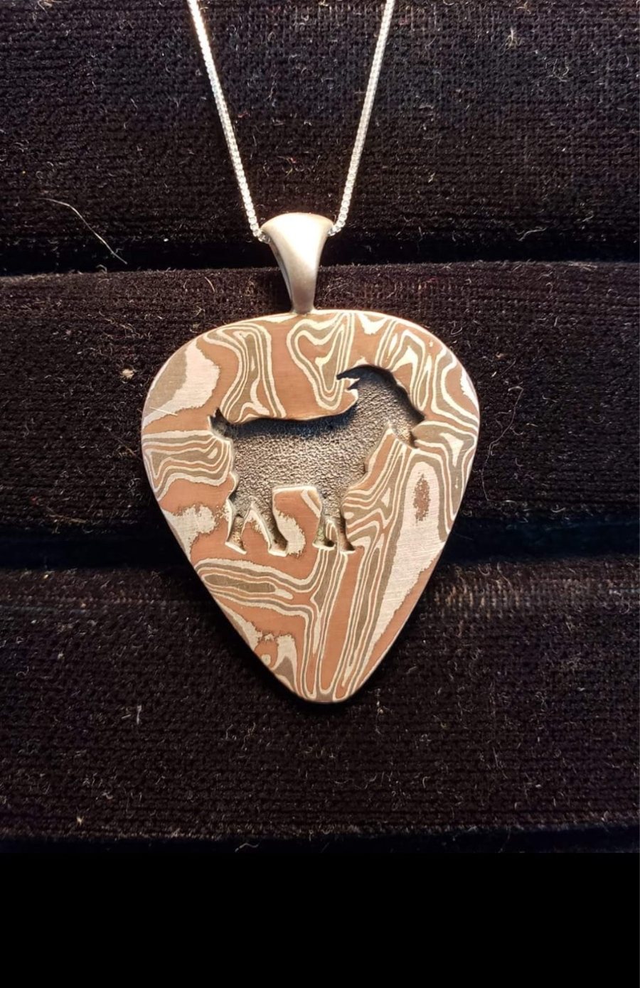 Mokume gane mountain goat pendant on a sterling silver chain