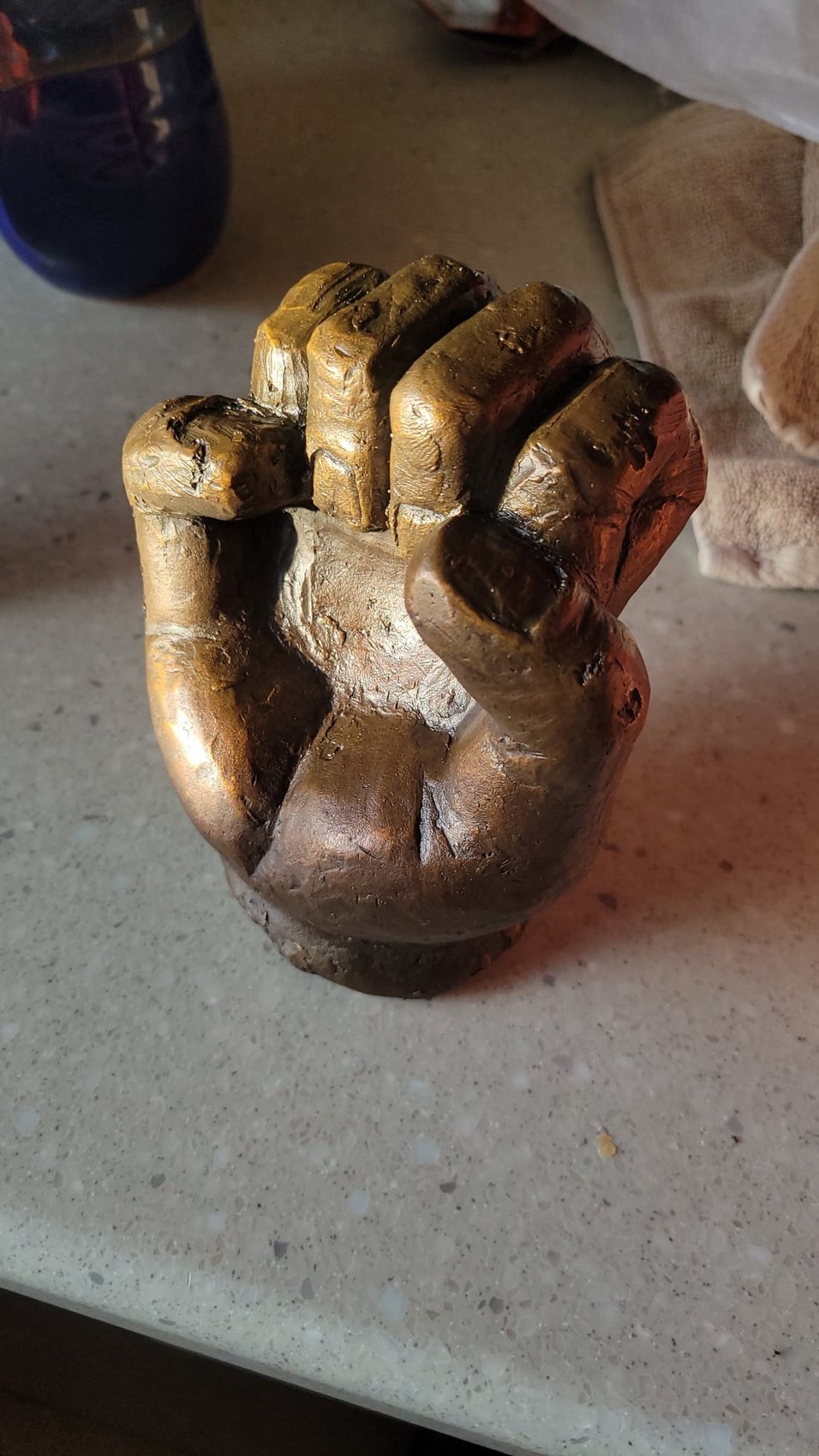 Cast bronze closed fist sculpture